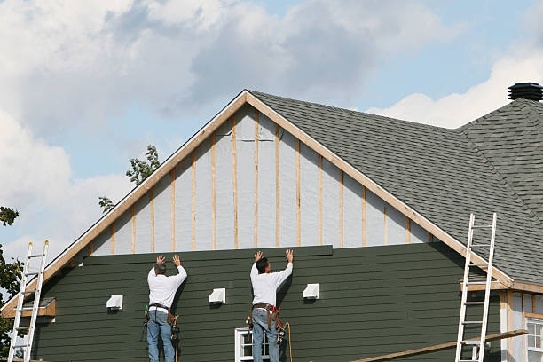 Professional Storm Damage Siding Repair technician working in Bethpage, NY